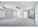 A bright main bedroom showcases an ensuite bath and closet with neutral decor and a ceiling fan at 14447 Waterlyn Dr, Charlotte, NC 28278