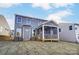 Rear exterior view of home with screened-in porch and view of the backyard at 130 Summerhill Dr # 16, Mooresville, NC 28115