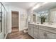 Elegant bathroom with double sinks, modern fixtures, and glass-enclosed shower at 130 Summerhill Dr # 16, Mooresville, NC 28115