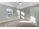 Bright bedroom featuring natural light from two windows and neutral walls at 130 Summerhill Dr # 16, Mooresville, NC 28115