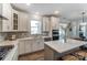 Well-equipped kitchen featuring stainless steel appliances, gray countertops, and ample natural light at 130 Summerhill Dr # 16, Mooresville, NC 28115