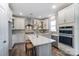 Bright kitchen featuring white cabinets, modern appliances, and stylish backsplash at 130 Summerhill Dr # 16, Mooresville, NC 28115