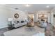 Open-concept living room with stylish sofa, round table, and easy access to the kitchen at 130 Summerhill Dr # 16, Mooresville, NC 28115