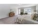 Comfortable bedroom featuring natural light, neutral tones, and cozy bedding at 130 Summerhill Dr # 16, Mooresville, NC 28115