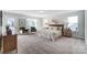Serene bedroom showcasing large windows, plush carpet, and elegant furnishings at 130 Summerhill Dr # 16, Mooresville, NC 28115