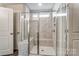 Modern bathroom showcasing glass-enclosed shower with tiled walls and seating at 130 Summerhill Dr # 16, Mooresville, NC 28115