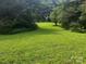 Large grassy backyard with lush green space at 5237 Nc Highway 90 E Hwy, Hiddenite, NC 28636