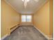Yellow bedroom with carpet and a ceiling fan at 5237 Nc Highway 90 E Hwy, Hiddenite, NC 28636