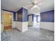 Blue bedroom with hardwood floors and built-in shelving at 5237 Nc Highway 90 E Hwy, Hiddenite, NC 28636