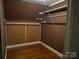 Spacious walk-in closet with wood floors and shelving at 5237 Nc Highway 90 E Hwy, Hiddenite, NC 28636