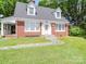 Red brick house with a white trim and a stone pathway at 5237 Nc Highway 90 E Hwy, Hiddenite, NC 28636