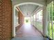 Front porch with brick flooring and white columns at 5237 Nc Highway 90 E Hwy, Hiddenite, NC 28636