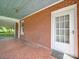 Side view of the front porch with brick exterior at 5237 Nc Highway 90 E Hwy, Hiddenite, NC 28636