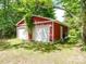 Detached two-car garage with white doors at 5237 Nc Highway 90 E Hwy, Hiddenite, NC 28636