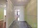Green hallway with carpet and access to bedrooms at 5237 Nc Highway 90 E Hwy, Hiddenite, NC 28636
