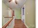 Hallway with light green walls and hardwood floors at 5237 Nc Highway 90 E Hwy, Hiddenite, NC 28636