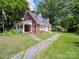 Brick house with stone pathway and porch at 5237 Nc Highway 90 E Hwy, Hiddenite, NC 28636