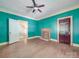Living room with fireplace and teal walls at 5237 Nc Highway 90 E Hwy, Hiddenite, NC 28636