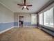 Spacious living room featuring carpet and large windows at 5237 Nc Highway 90 E Hwy, Hiddenite, NC 28636