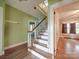 View of a classic staircase and hardwood floors at 5237 Nc Highway 90 E Hwy, Hiddenite, NC 28636