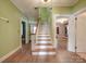 Classic staircase with hardwood floors and green walls at 5237 Nc Highway 90 E Hwy, Hiddenite, NC 28636
