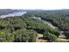 Aerial view of property near a lake with mountain views at 248 Pioneer Dr # 990, Mount Gilead, NC 27306
