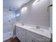 Modern bathroom with double vanity, marble shower, and updated fixtures at 248 Pioneer Dr # 990, Mount Gilead, NC 27306