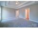 Bright bedroom featuring carpeted floors and access to closets at 248 Pioneer Dr # 990, Mount Gilead, NC 27306