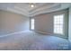 Spacious bedroom with carpeted floors and two large windows at 248 Pioneer Dr # 990, Mount Gilead, NC 27306