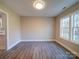 Bright dining room with hardwood floors and large windows at 248 Pioneer Dr # 990, Mount Gilead, NC 27306