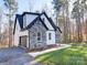 Two-story house with stone and white siding, featuring a two car garage at 248 Pioneer Dr # 990, Mount Gilead, NC 27306