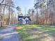 Craftsman style home with stone and white accents, located on a wooded lot at 248 Pioneer Dr # 990, Mount Gilead, NC 27306