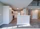 Modern kitchen features white cabinets, gray flooring and stainless steel appliances at 248 Pioneer Dr # 990, Mount Gilead, NC 27306