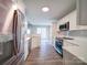 Modern kitchen with stainless steel appliances and white cabinets at 248 Pioneer Dr # 990, Mount Gilead, NC 27306