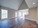 Open concept living room with hardwood floors and kitchen at 248 Pioneer Dr # 990, Mount Gilead, NC 27306