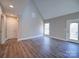 Spacious living area with hardwood floors and access to deck at 248 Pioneer Dr # 990, Mount Gilead, NC 27306
