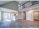 Open concept living room, hardwood floors and kitchen with island at 248 Pioneer Dr # 990, Mount Gilead, NC 27306