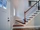 Modern staircase with dark wood and white accents at 248 Pioneer Dr # 990, Mount Gilead, NC 27306