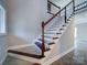 Elegant wooden staircase with white railings at 248 Pioneer Dr # 990, Mount Gilead, NC 27306