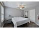 Comfortable bedroom with hardwood floors, modern lighting, and a serene ambiance at 17615 Trolley Crossing Way, Cornelius, NC 28031