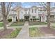 Charming townhome showcasing landscaped front yard and inviting entryway at 17615 Trolley Crossing Way, Cornelius, NC 28031