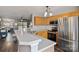 Bright kitchen featuring stainless steel appliances, breakfast bar, and open floor plan at 17615 Trolley Crossing Way, Cornelius, NC 28031