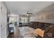 Open concept living space featuring hardwood floors, large windows and comfortable seating at 17615 Trolley Crossing Way, Cornelius, NC 28031
