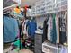 Organized walk-in closet with shelving, hanging racks, and storage containers at 17615 Trolley Crossing Way, Cornelius, NC 28031