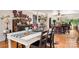 Farmhouse dining area with a large wooden table and a view to the backyard at 11732 Kennewick Rd, Charlotte, NC 28216