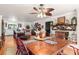 Bright dining room features a wooden table, red chairs, and a fireplace at 11732 Kennewick Rd, Charlotte, NC 28216