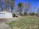 The property boasts a spacious backyard with a detached garage and covered patio that offer outdoor possibilities at 553 Georgia Ave, Statesville, NC 28677