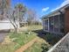Cozy backyard featuring a detached garage and a charming screened-in porch for relaxation and outdoor enjoyment at 553 Georgia Ave, Statesville, NC 28677