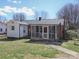 Charming home showcasing a quaint screened porch and a spacious backyard perfect for outdoor activities at 553 Georgia Ave, Statesville, NC 28677
