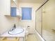 This bathroom features a shower with sliding glass door and white cabinet sink with marble counter at 553 Georgia Ave, Statesville, NC 28677